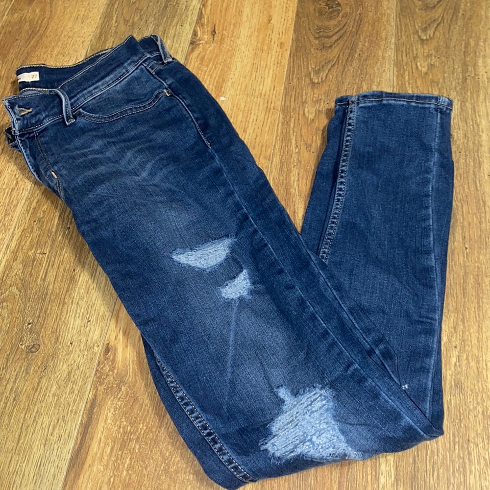 Levis ripped blue jeans
